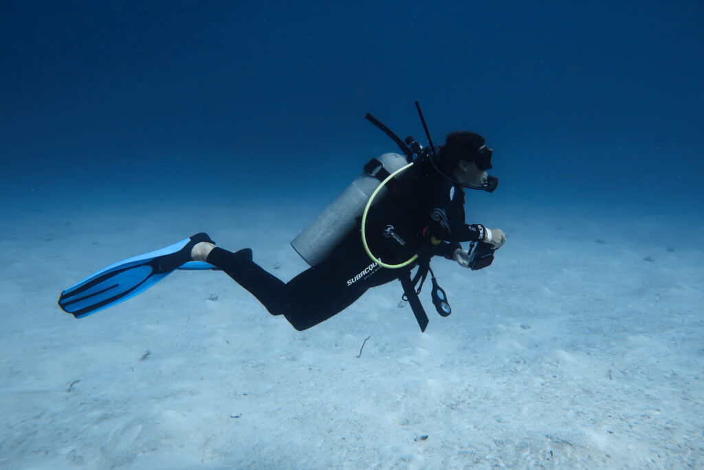 Scuba diver exploring the reef at Takata Experience in Mahahual. Beginner diving destinations